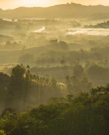 Mist-covered mountains. The sun rising in the morning fresh air in the winter.の写真素材