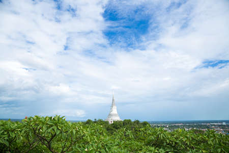 White pagoda on the mountain at the back is sky and city views.の写真素材