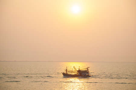 View of sea when sun is nearly down with clear skyの写真素材