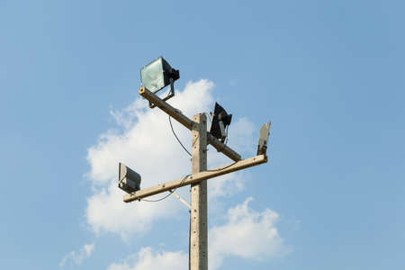 Lonely streetlight on midday with cloudy blue skyの写真素材