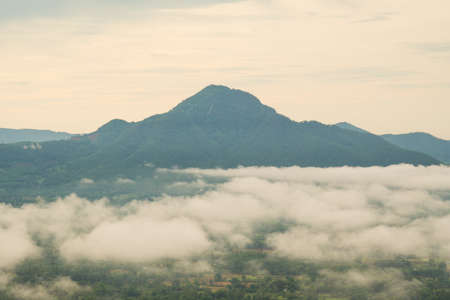 Mountains and fog in the morning. The mist covered the mountains in the morning.の写真素材