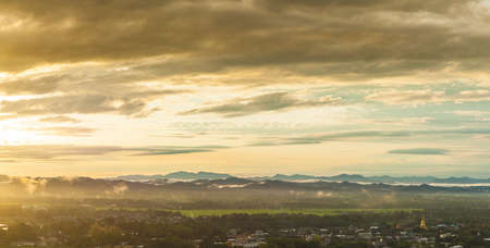 Towns and mountains In the evening, the sun was falling.
