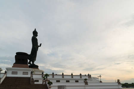 Large buddha in morning. cloud cover sky and sunlight.の写真素材