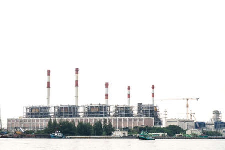 Power plant near the river Machinery and chimneys in power plantsのeditorial素材