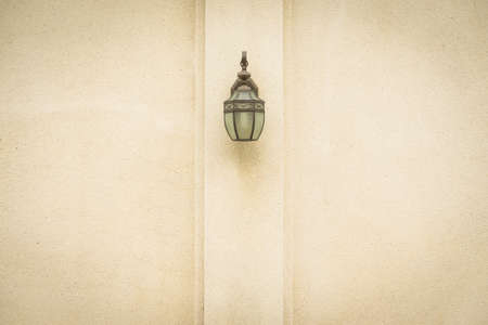 Lamp on brown wall. Classic lamp on home wall.の写真素材