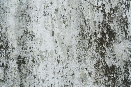 Old plaster walls that have been eroded and stainedの写真素材