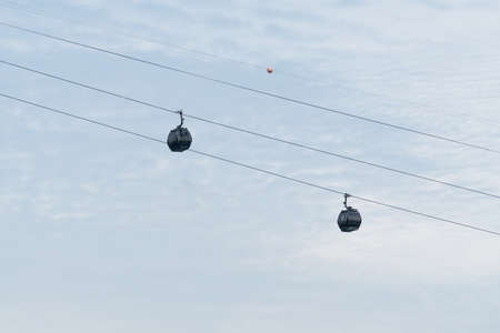 Cable car on wire. transport over island transit. Cloud backgruond in season summer.