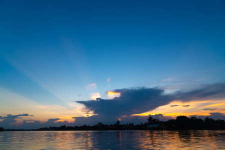 Sky cloudscape and sunset in evening. River and sky in evening.の写真素材