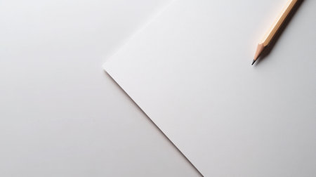A close up of blank sheet of paper with pencil resting beside it, inviting creativityの素材