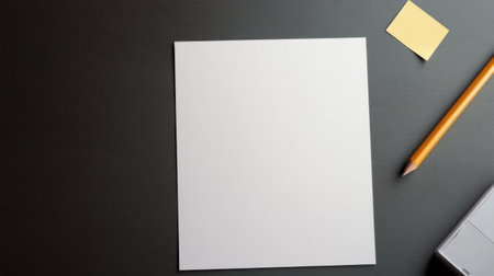 A blank sheet of paper and pencil on deskの素材