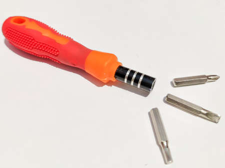 Multi purpose screw driver with variable bits for small electric object to repair isolated white...