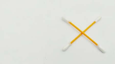 A group of ear swabs or cotton ear sticks on the light background. Ear care concept for Hygiene.の写真素材