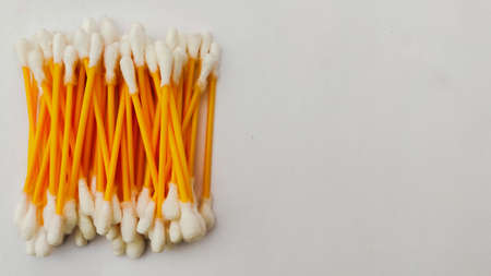A group of ear swabs or cotton ear sticks on the light background. Ear care concept for Hygiene.の写真素材