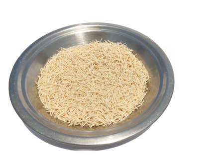 Hand made Uncooked Vermicelli in steel plateの写真素材