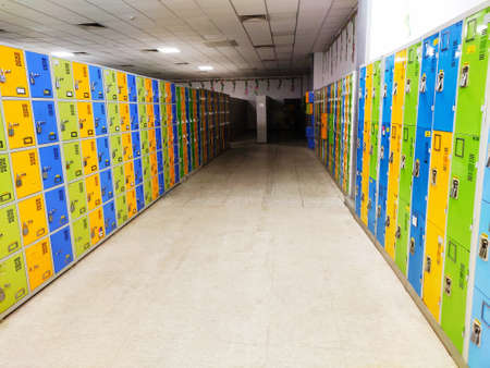 Many colourful locked lockers in locker room.の写真素材