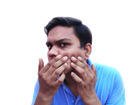 Young Boy press Pimples to squeeze out on faceの写真素材