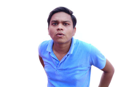 Uncertain young man facial expression asking question.の写真素材