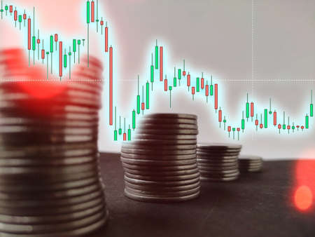 Coin stack step down graph with decreasing candlesticks graph, Risk management business financial and investment, Copy spaceの写真素材