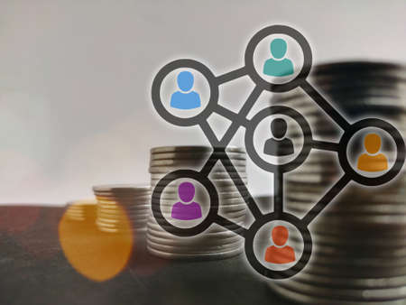 Persons connection build team to earn money, coins stack increase conceptの写真素材