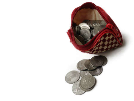 Coins in ladies purse on White backgroundの写真素材