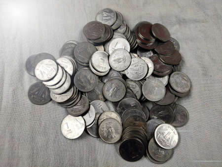 Indian rupees coins stack or heap on white background Selective Focusの写真素材