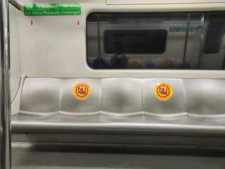 DELHI/INDIA- 03 DECEMBER 2020: Warning sign on seat inside Delhi metro train due to corona virus. Keep distance, do not sit here. Keep gap of one seat while sitting.のeditorial素材