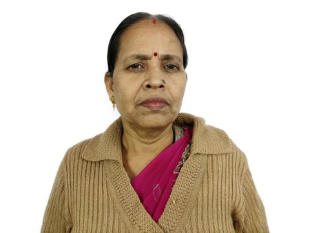 Indian Hindu woman middle aged old lady wearing winter cloths sweaters.の写真素材