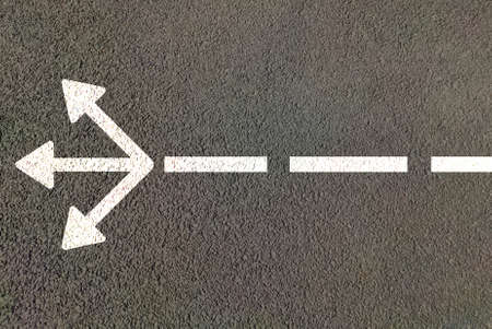 Three way road arrow for choosing direction of path , diffrent options and confusion in choise of best way concept.の写真素材