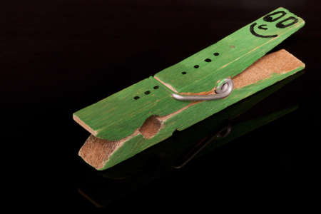 green colored  clothespin with smiley on itの写真素材