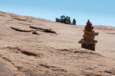 plateau of red sandstone with lonesome stone towerの写真素材