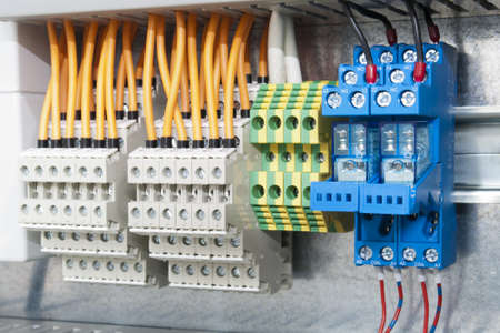 wired electrical board with terminals and cutout on metal bar