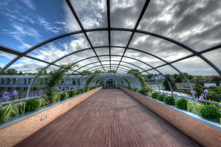 outdoor corridor with wooden floor and flowersの写真素材