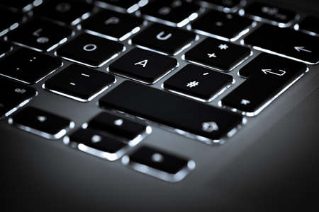 illuminated keyboard keys of portable computer notebook
