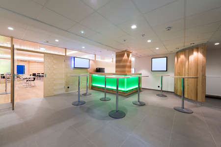 illuminated wooden lounge with tv and stands with bar