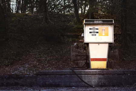 old gasoline pump for diesel on concrete platformの写真素材