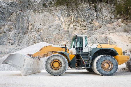 side view of large and heavy wheel mounted front loader at mineの写真素材