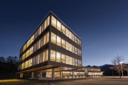huge wooden timber sustainable office building at dawn huge wooden timber sustainable office building at dawn