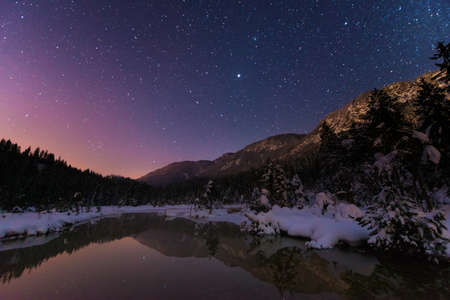 Lake Riedenersee at night with stars in winterの写真素材