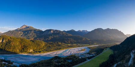 lech river plait in hoefen reutte austria at fall sunset with mountainsの写真素材