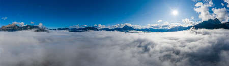 panorama of cloud bank with view to mountains around ferienregion reutteの写真素材