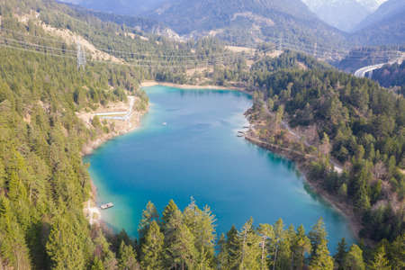 fresh blue lake urisee from above at spring in wonderful austrian natureの写真素材