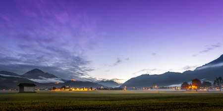 Panorama of the reutte holiday region at night with the ruin ehrenberg and the hahnenkamm and...