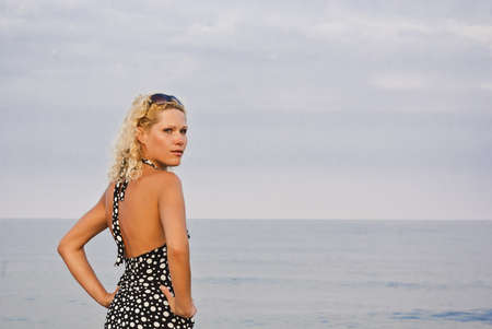 Single young women standing on coast