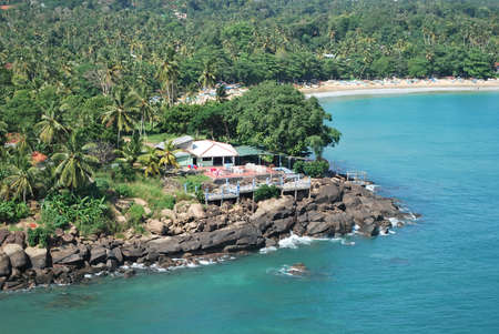 Tropical resort with blue lagoon and stone pierの写真素材