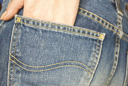 Jeans pocket close up and hand