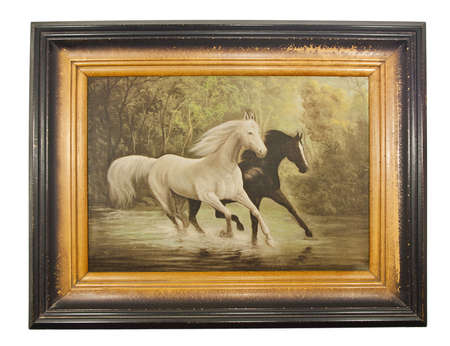 Tne picture Two horses in old frame, vintage, isolated on whiteの写真素材
