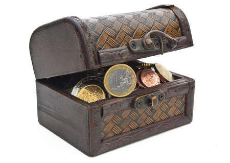 Antique box with coins isolated on whiteの写真素材