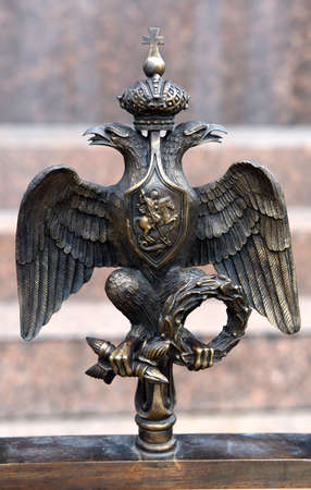 The coat of arms of Imperial Russia. Fragment of an ancient wall. St. Petersburg, Russia, July 23, 2015.のeditorial素材