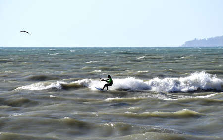 Sochi, Russia, on April 28, 2016. The man is engaged in kitesurfing in the sea.のeditorial素材