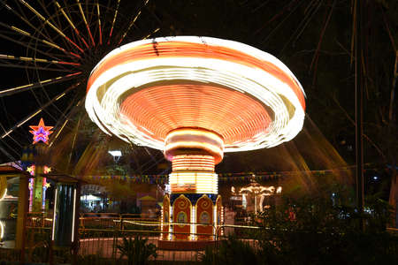 Sochi, Russia. 12 Aug 2016. Fair rides, night scene long exposure.のeditorial素材